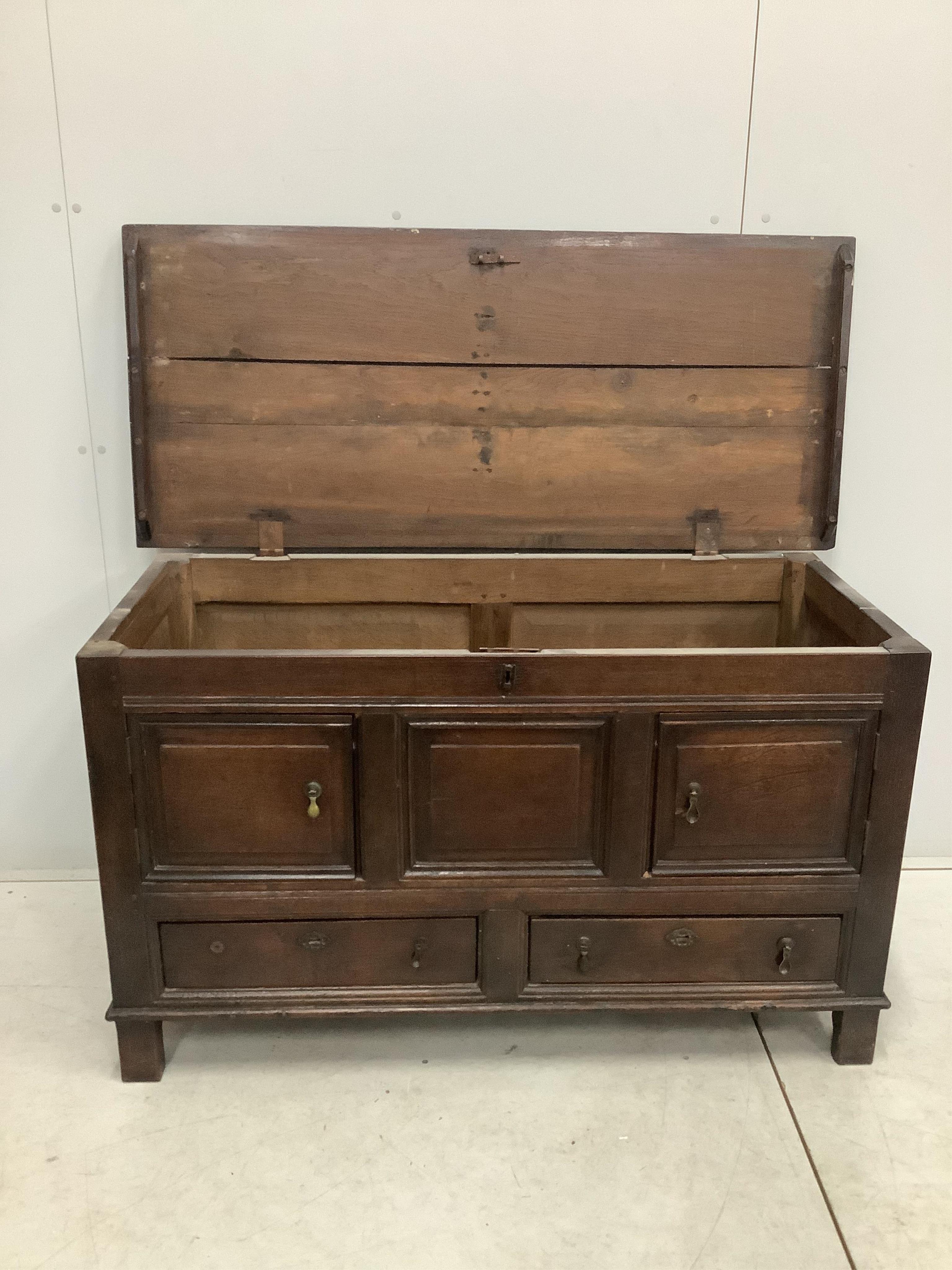 An 18th century oak mule chest, adapted, width 132cm, depth 56cm, height 77cm. Condition - fair